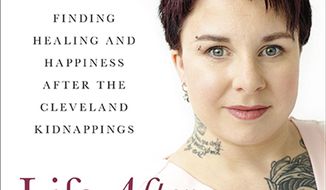 This image provided by Hachette Books shows the cover of Michelle Knight&#39;s book Life After Darkness. Five years after being rescued from a decade-long captivity in chains inside a heavily fortified Cleveland house, kidnapping survivor Knight published her second book, focusing on her recovery and life afterward, including her marriage. (Deborah Feingold Photography/Hachette Books via AP)