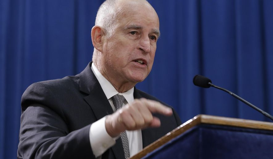 Gov. Jerry Brown discusses lawsuit filed by 17 states and the District of Columbia over the Trump administration's plans to scrap vehicle emission standards during a news conference Tuesday, May 1, 2018, in Sacramento, Calif. The U.S. Environmental Protection Agency has moved to scrap tailpipe emissions standards for vehicles manufactured between 2022 and 2025. (AP Photo/Rich Pedroncelli)