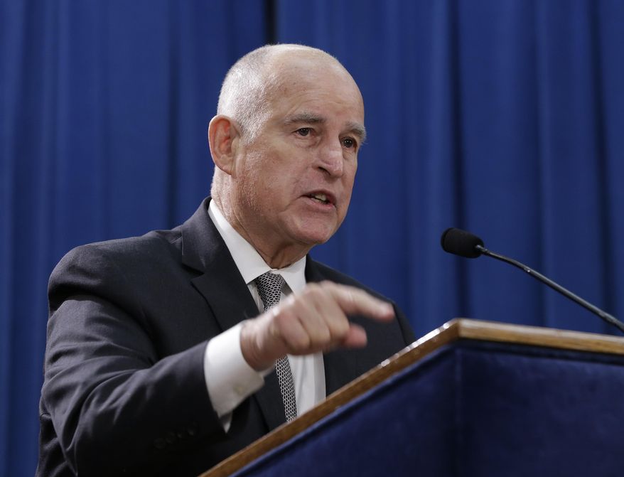 Gov. Jerry Brown discusses lawsuit filed by 17 states and the District of Columbia over the Trump administration's plans to scrap vehicle emission standards during a news conference Tuesday, May 1, 2018, in Sacramento, Calif. The U.S. Environmental Protection Agency has moved to scrap tailpipe emissions standards for vehicles manufactured between 2022 and 2025. (AP Photo/Rich Pedroncelli)