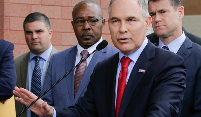 CORRECTS THE POSITION OF PERROTTA TO LEFT, NOT SECOND LEFT - FILE - In this April 19, 2017, file photo, Environmental Protection Agency Administrator Scott Pruitt speaks at a news conference with Pasquale &amp;quot;Nino&amp;quot; Perrotta, left, in East Chicago, Ind. Pruitt is announcing the departure of two top aides amid ethics investigations at the agency. Pruitt says his security chief, Pasquale &amp;quot;Nino&amp;quot; Perrotta, was retiring. He gave no cause, but Pruitt&#x27;s spending on security at the EPA is the subject of ongoing federal investigations. Pruitt also announced the departure of Albert Kelly, a former Oklahoma banker in charge of the toxic waste cleanups. (AP Photo/Teresa Crawford, File)