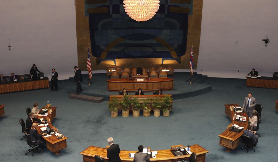 The Hawaii State Senate discusses legislation at the state Capitol in Honolulu on Tuesday, May 1, 2018. Hawaii lawmakers were expected to vote on a slew of bills as this year's legislative session wraps up. (AP Photo/Sophia Yan)
