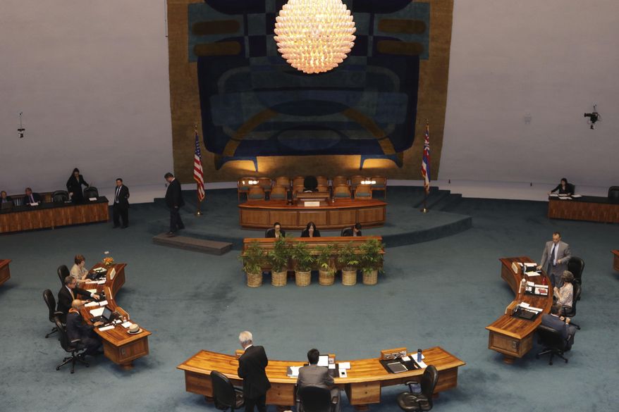 The Hawaii State Senate discusses legislation at the state Capitol in Honolulu on Tuesday, May 1, 2018. Hawaii lawmakers were expected to vote on a slew of bills as this year's legislative session wraps up. (AP Photo/Sophia Yan)