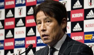 In this photo taken on Thursday, April 12, 2018, Japan Football Association (JFA) new coach Akira Nishino speaks during a press conference at its headquarters in Tokyo. (AP Photo/Shizuo Kambayashi)
