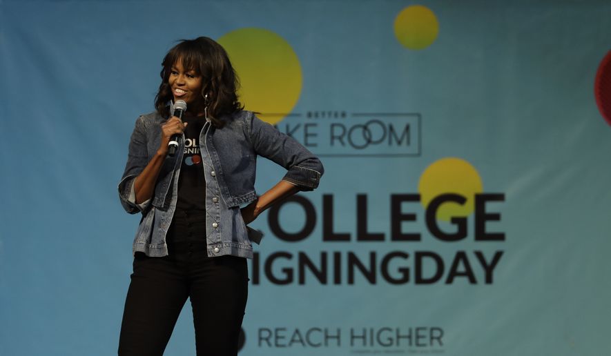 Michelle Obama speaks at College Signing Day, an event honoring Philadelphia students for their pursuit of a college education or career in the military, Wednesday, May 2, 2018, at Temple University in Philadelphia. (AP Photo/Matt Slocum)