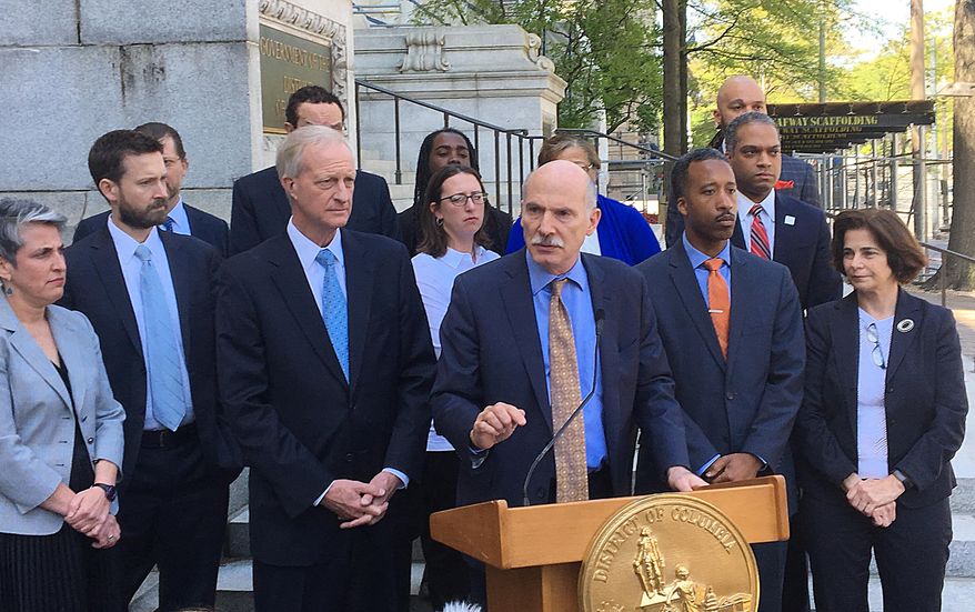District of Columbia City Council President Phil Mendelson speaks during an impromptu news conference outside City Hall, Tuesday, May 1, 2018, in Washington, as other council members listen.  (AP Photo/Ashraf Khalil) **FILE**