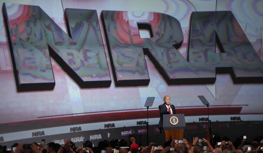 In this April 28, 2017, file photo, President Donald Trump speaks during the National Rifle Association-ILA Leadership Forum, in Atlanta. As NRA prepares to gather for its 147th annual meeting in Dallas, the political landscape has changed considerably in the past year. Even with a GOP-led Congress and a gun-friendly president in the White House, its agenda has stalled. And a new generation seems to have the upper hand in pushing for gun-control after several deadly mass shootings. (AP Photo/Mike Stewart File)