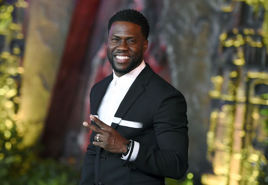 FILE - In this Dec. 11, 2017 file photo, Kevin Hart arrives at the Los Angeles premiere of "Jumanji: Welcome to the Jungle" in Los Angeles. A man has been charged with trying to extort money from Kevin Hart by threatening to release video he had secretly shot of the actor and comedian with a woman in Las Vegas. Los Angeles County prosecutors charged 41-year-old Jonathan Jackson on Wednesday May 2, 2018, with attempted extortion and extortion by threatening letter. Jackson is jailed on $100,000 bail. (Photo by Jordan Strauss/Invision/AP, File)