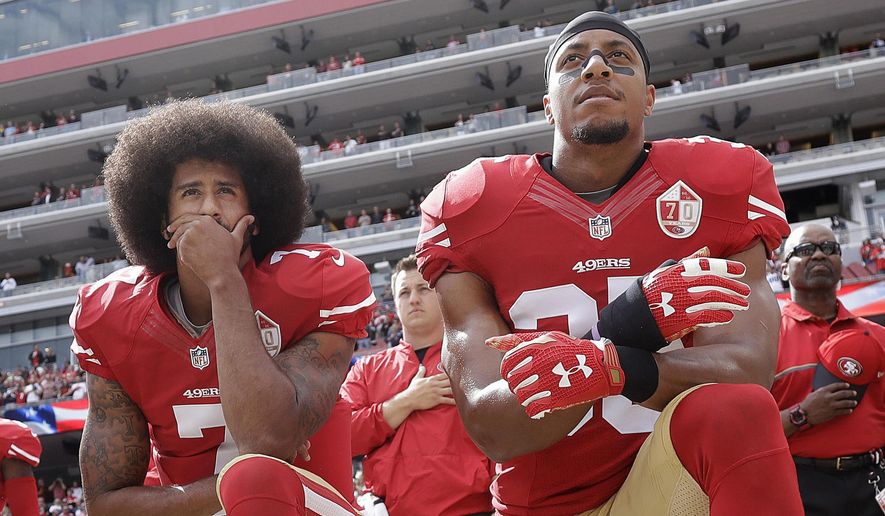 FILE - In this Oct. 2, 2016, file photo, San Francisco 49ers quarterback Colin Kaepernick, left, and safety Eric Reid kneel during the national anthem before an NFL football game against the Dallas Cowboys in Santa Clara, Calif. The NFL players&#39; union says former San Francisco 49ers safety Eric Reid filed a grievance against the league, alleging that he remains unsigned as a result of collusion by owners. Reid had joined former teammate Colin Kaepernick two seasons ago in kneeling during the national anthem to protest police brutality and racial inequality. (AP Photo/Marcio Jose Sanchez, File)