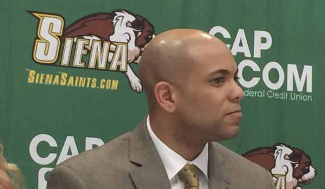 Jamion Christian is introduced Wednesday May 2, 2018, as the new Siena men&#x27;s basketball coach at Times Union Center in downtown Albany, N.Y. Christian, who has spent the past six seasons as head coach at his alma mater, Mount St. Mary&#x27;s, replaces Jimmy Patsos, the school announced Wednesday. (AP Photo/John Kekis)