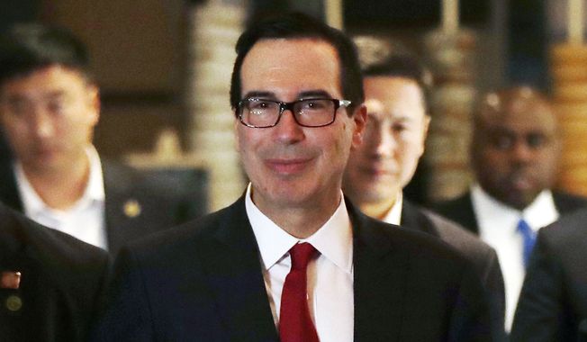 U.S. Treasury Secretary Steven Mnuchin arrives with his delegation at a hotel after meeting with Chinese officials in Beijing, Thursday, May 3, 2018. (AP Photo/Andy Wong) ** FILE **