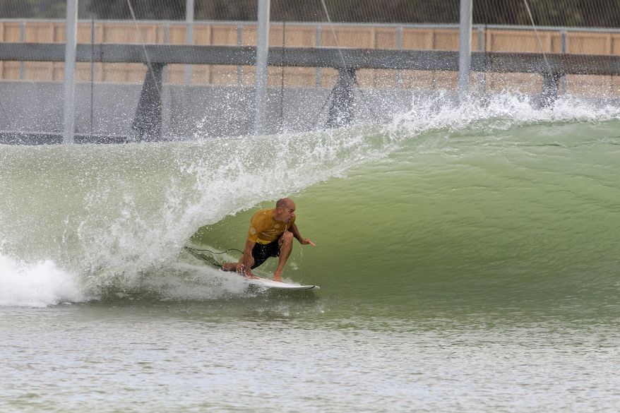 In this September 2017 photo provided by World Surf League, eleven-time World Champion Kelly Slater rides a wave at the Future Classic surfing meet in Lemoore, Calif. Slater has not only found what could be the perfect wave, but he's created it. Slater will introduce his Surf Ranch in Lemoore to the world this weekend, when the two-day Founders' Cup of Surfing is held on May 5 and 6, 2018, in a nondescript corner of California's Central Valley, some 100 miles from the Pacific Ocean. (Kenneth Morris/World Surf League via AP)