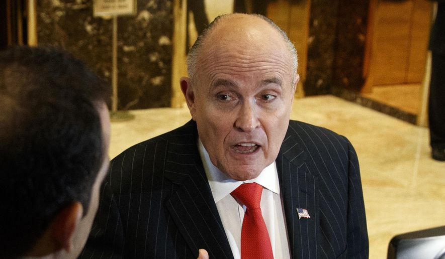 In this Jan. 12, 2017, file photo, former New York City Mayor Rudy Giuliani talks with reporters in the lobby of Trump Tower in New York. (AP Photo/Evan Vucci, File)