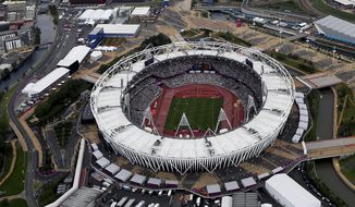 FILE - This Aug. 3, 2012, aerial file photo shows the Olympic Stadium at Olympic Park, in London. A person familiar with the planning tells The Associated Press that Major League Baseball intends to announce next week plans have been finalized to have the New York Yankees and Boston Red Sox play a two-game series at London’s Olympic Stadium on June 29-30 next year. The person spoke on condition of anonymity Thursday, May 3, 2018, because no public comments were authorized. These will be the first regular-season MLB games in Europe. The Red Sox will be the home team for the both games. (AP Photo/Jeff J Mitchell, File) **FILE**