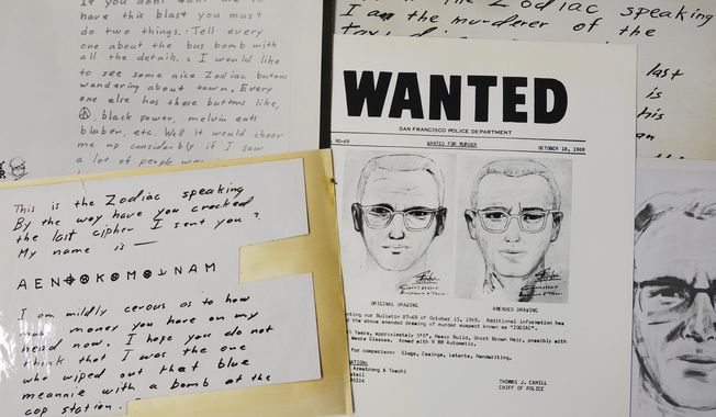 A San Francisco Police Department wanted bulletin and copies of letters sent to the San Francisco Chronicle by a man who called himself Zodiac are displayed Thursday, May 3, 2018, in San Francisco. Detectives in Northern California are trying to get a DNA profile on the Zodiac Killer to track him down using the same family-tree tracing technology investigators used in the Golden State Killer case. Vallejo police Detective Terry Poyser tells the Sacramento Bee his agency has recently submitted two envelopes that contained letters from the Zodiac Killer for DNA analysis. The Zodiac Killer stabbed or shot to death five people in Northern California in 1968 and 1969. He was dubbed the Zodiac Killer after he sent taunting letters and cryptograms to police and newspapers that included astrological symbols. (AP Photo/Eric Risberg)