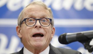 FILE- In this Nov. 30, 2017, file photo, Ohio Attorney General and former U.S. Sen. Mike DeWine speaks before introducing Ohio Secretary of State Jon Husted during a news conference in Dayton, Ohio. Records show a Cincinnati anti-abortion activist was in regular contact with DeWine’s office during a probe of Planned Parenthood and that some of her advice was passed on to state investigators. (AP Photo/John Minchillo, File)