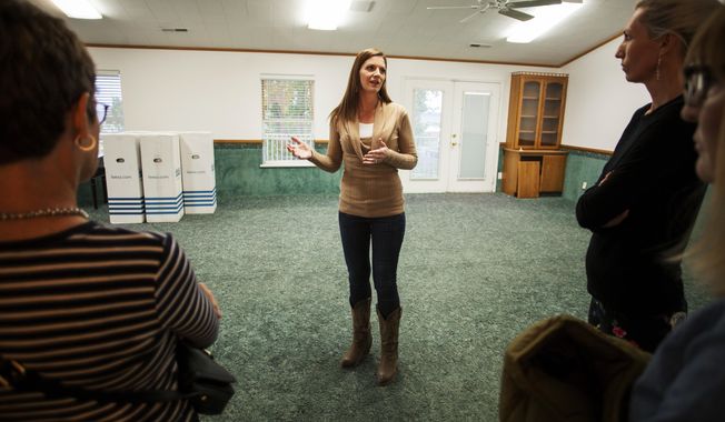 In this April 30, 2018, photo, Jena Jones, Director of the Short Creek Dream Center, guides a tour through the renovated facility, formally the home of polygamous sect leader Warren Jeffs in Hildale, Utah. The sprawling house surrounded by towering brick walls has been converted into a sober living center by Evangelical missionaries, the latest sign of the group’s dwindling control of the small community on the Utah-Arizona border. (Chris Caldwell/The Spectrum via AP)