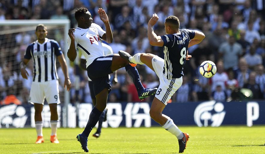 Tottenham Hotspur&#39;s Victor Wanyama, left and West Bromwich Albion&#39;s Jake Livermore battle for the ball during the English Premier League soccer match between West Bromwich Albion and Tottenham Hotspur at The Hawthorns, in West Bromwich, England, Saturday May 5, 2018. (Anthony Devlin/PA via AP)