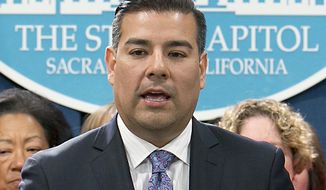 FILE - In this May 31, 2017 file photo, state Sen. Ricardo Lara, D-Bell Gardens, accompanied by members of the California Nurses Association, discusses his single-payer health care bill at a Capitol news conference. Lara is a candidate for California Insurance Commissioner in the upcoming California primary election. (AP Photo/Rich Pedroncelli, File)