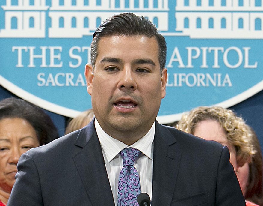 FILE - In this May 31, 2017 file photo, state Sen. Ricardo Lara, D-Bell Gardens, accompanied by members of the California Nurses Association, discusses his single-payer health care bill at a Capitol news conference. Lara is a candidate for California Insurance Commissioner in the upcoming California primary election. (AP Photo/Rich Pedroncelli, File)