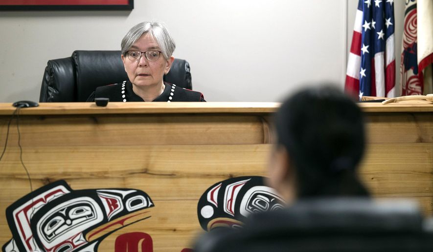 Judge Deb O'Gara works in the Central Council Tlingit and Haida Indian Tribes of Alaska's Tribal Court in Juneau, Alaska, March 14, 2018. The feel of the Tribal Court is very welcoming, and O'Gara prides herself on being able to find the balance between making people comfortable while also taking the proceedings very seriously. (Michael Penn/Juneau Empire via AP)