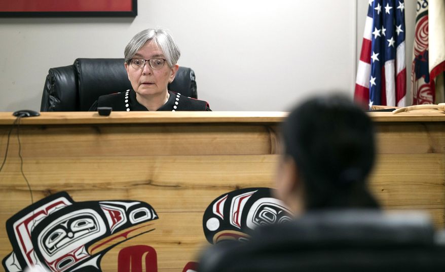 Judge Deb O'Gara works in the Central Council Tlingit and Haida Indian Tribes of Alaska's Tribal Court in Juneau, Alaska, March 14, 2018. The feel of the Tribal Court is very welcoming, and O'Gara prides herself on being able to find the balance between making people comfortable while also taking the proceedings very seriously. (Michael Penn/Juneau Empire via AP)