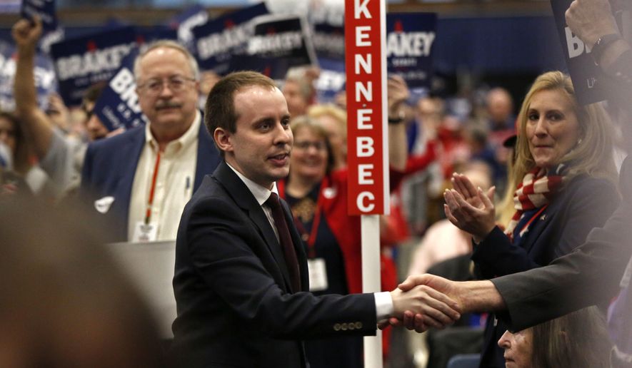 State Sen. Eric Brakey, R-Auburn, a candidate for U.S. Senate, greets supporters at the Republican Convention, Saturday, May 5, 2018, in Augusta, Maine. (AP Photo/Robert F. Bukaty)