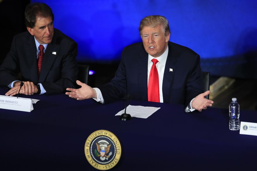 President Donald Trump with Rep. Jim Renacci, R-Ohio, left, speaks during a roundtable discussion on tax reform at Cleveland Public Auditorium and Conference Center in Cleveland, Ohio, Saturday, May 5, 2018. (AP Photo/Manuel Balce Ceneta)