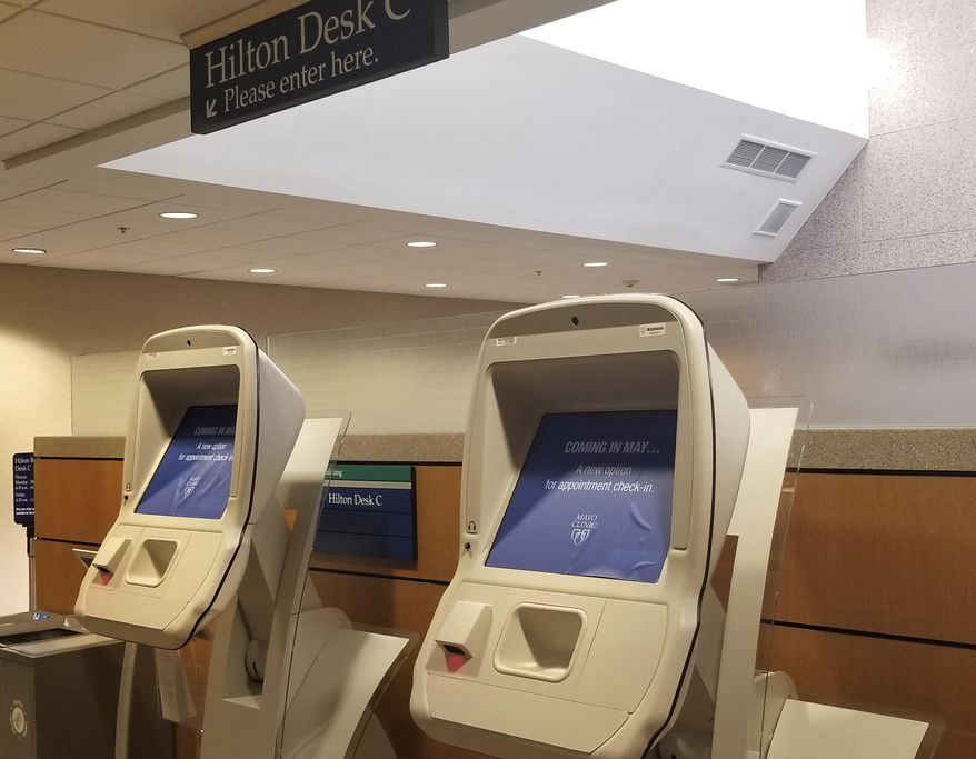 Two of the 51 Mayo Clinic appointment kiosks photographed in the Hilton Building in Rochester Minn., on April 27, 2018, are set to go online Saturday will work with a new online patient portal that is part of the Epic Systems transition. (Jeff Kiger/The Rochester Post-Bulletin via AP)