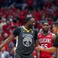 Golden State Warriors forward Draymond Green (23) challenges an official in front of New Orleans Pelicans forward E&#39;Twaun Moore (55) in the first half of Game 4 of a second-round NBA basketball playoff series in New Orleans, Sunday, May 6, 2018. (AP Photo/Gerald Herbert)