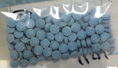 This undated photo made available by the U.S. Drug Enforcement Administration shows heroin fentanyl pills. (DEA via AP)