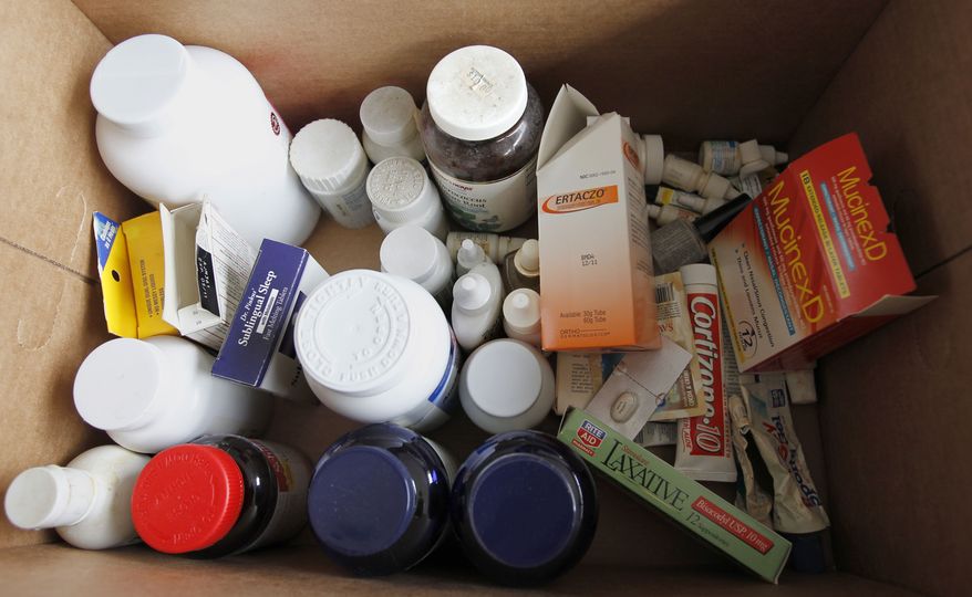 Bottles and boxes of surplus and expired medications that Kathy Burke of Gibsonia, were brought to the Allegheny County police station in North Park to be disposed of on Saturday, April 28, 2012, in Allison Park, Pa. This collection point is just one that is part of the the fourth National Prescription Drug Take Back Day hosted by the federal Drug Enforcement Administration. The goal is to help prevent abuse of their purpose, to keep the drugs away from children they weren't intended for and to dispose of them in a safe and controlled manner. Burke said she collected many of them from her mother's home after she passed away. (AP Photo/Keith Srakocic)