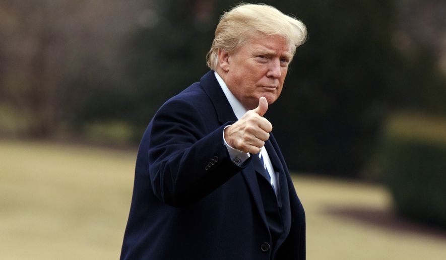 President Donald Trump gives a thumbs up as he walks on the South Lawn of the White House after arriving aboard Marine One, Thursday, Feb. 1, 2018, in Washington. (AP Photo/Evan Vucci)
