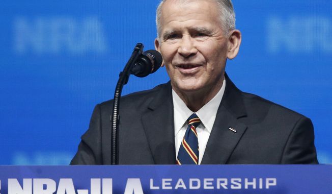Former U.S. Marine Lt. Col. Oliver North speaks before giving the Invocation at the National Rifle Association-Institute for Legislative Action Leadership Forum in Dallas. The NRA announced today that North will become President of the National Rifle Association of America within a few weeks, a process the NRA Board of Directors initiated this morning. (AP Photo/Sue Ogrocki)