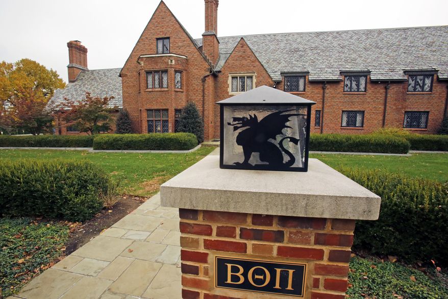 FILE – This Nov. 9, 2017, file photo shows Pennsylvania State University's shuttered Beta Theta Pi fraternity house in State College, Pa. Centre County, Pa., Magisterial District Judge Steven Lachman said Monday, May 7, 2018, there's enough evidence for 11 more Penn State fraternity members to stand trial in county court on hazing and alcohol-related charges over the Feb. 4, 2017, death of 19-year-old fraternity pledge Timothy Piazza, of Lebanon, N.J., after a night of heavy drinking. The judge pared down other counts, while dismissing all reckless endangerment counts and allegations a fraternity member erased basement security video to thwart investigators. (AP Photo/Gene J. Puskar, File)