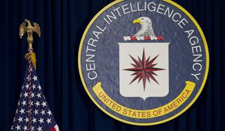 This April 13, 2016 file photo shows the seal of the Central Intelligence Agency at CIA headquarters in Langley, Va.  (AP Photo/Carolyn Kaster, File)