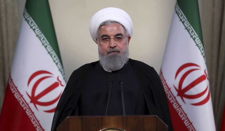 In this photo released by official website of the office of the Iranian Presidency, President Hassan Rouhani addresses the nation in a televised speech in Tehran, Iran, Tuesday, May 8, 2018. Iranian President Hassan Rouhani said Tuesday he&#39;d send his foreign minister to negotiate with countries remaining in the nuclear deal after Donald Trump&#39;s decision to pull America from the deal, warning he otherwise would restart enriching uranium &quot;in the next weeks.&quot; (Iranian Presidency Office via AP)