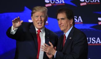 FILE - In this May 5, 2018, file photo, President Donald Trump with Rep. Jim Renacci, R-Ohio, right, waves during a roundtable discussion on tax cuts at Cleveland Public Auditorium and Conference Center in Cleveland, Ohio. Renacci has said he joined the Senate race with White House encouragement, after Ohio Treasurer Josh Mandel withdrew because of his wife’s health issue. Renacci had been running for governor, while Cleveland investment banker Mike Gibbons was already in the Senate race. (AP Photo/Manuel Balce Ceneta, File)