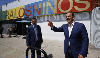Gubernatorial candidate Antonio Villaraigosa, the former mayor of Los Angeles and state Assembly speaker, right, visits Para Los Ninos Education Center, a social service and education organization dedicated to serve needy children and families in Los Angeles Monday, May 7, 2018. Drew Furedi, left, the center&#39;s President and CEO, stands beside Villaraigosa. The Democratic front-runner, Gavin Newsom, wants to face a Republican, but rival John Cox is locked in a struggle for second place with Villaraigosa, a Democrat. (AP Photo/Damian Dovarganes)