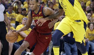 FILE - In this April 27, 2018, file photo, Cleveland Cavaliers&#39; Rodney Hood, left, heads to the basket past Indiana Pacers&#39; Trevor Booker during the first half of Game 6 of a first-round NBA basketball playoff series, in Indianapolis. A person familiar with the situation says the Cavaliers will not fine or suspend forward Rodney Hood for refusing to enter Game 4 against Toronto. The Athletic reported that Hood angered his teammates and others in the organization when he declined coach Tyronn Lue’s request to replace LeBron James with 7:38 left and the Cavs leading by 30. Hood spoke to team officials about the incident Tuesday, May 8, 2018, and will not be disciplined, said the person who spoke to the Associated Press on condition of anonymity because of sensitivity.(AP Photo/Darron Cummings, File)