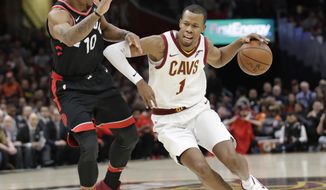 FILE - In this April 3, 2018, file photo, Cleveland Cavaliers&#39; Rodney Hood (1) drives past Toronto Raptors&#39; DeMar DeRozan (10) during the first half of an NBA basketball game in Cleveland. A person familiar with the situation says the Cavaliers will not fine or suspend forward Rodney Hood for refusing to enter Game 4 against Toronto. The Athletic reported that Hood angered his teammates and others in the organization when he declined coach Tyronn Lue’s request to replace LeBron James with 7:38 left and the Cavs leading by 30. Hood spoke to team officials about the incident Tuesday, May 8, 2018, and will not be disciplined, said the person who spoke to the Associated Press on condition of anonymity because of sensitivity.(AP Photo/Tony Dejak, File)