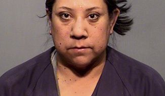 This undated booking photo provided by Coconino County Detention Facility shows Karis Begaye. Begaye, the chief legal counsel to the Navajo Nation president has been placed on administrative leave, weeks after she was arrested on suspicion of driving while intoxicated. Navajo President Russell Begaye made the announcement Tuesday, May 8, 2018, that the legal counsel, Karis Begaye, is his daughter. (Coconino County Detention Facility via AP)