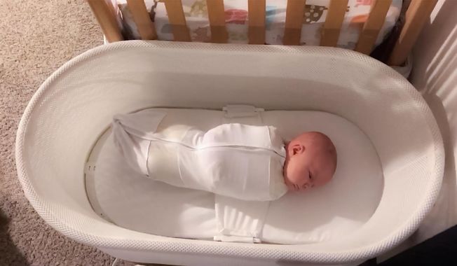 This Jan. 3, 2017 photo released by Paul Zalewski shows his infant daughter Ruby in a smart-tech sleeper called the Snoo, which gently rocks and jiggles babies to sleep from birth to 6 months old. (Paul Zalewski via AP) **FILE**