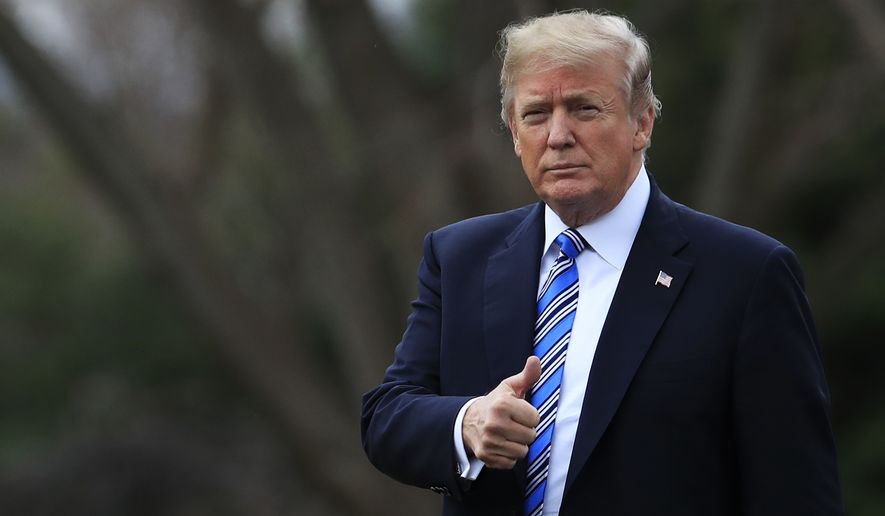 President Donald Trump flashes a thumbs up as he leaves the White House, Friday, Feb. 16, 2018, in Washington. (AP Photo/Manuel Balce Ceneta)