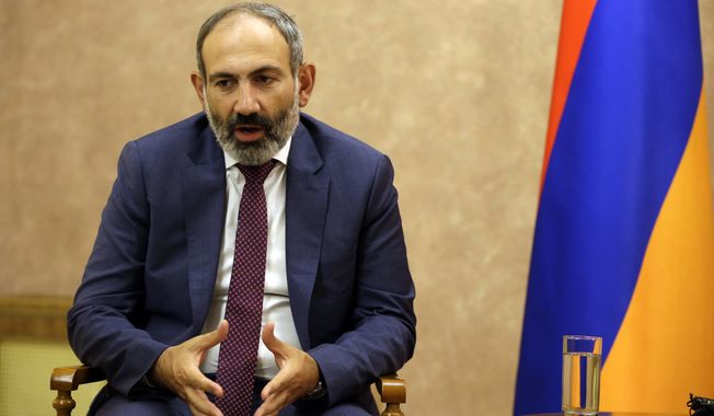 Armenia&#x27;s Prime Minister Nikol Pashinian speaks with the President Bako Sahakyan of the separatist Nagorno-Karabakh region speaks during their meeting in the capital Stepanakert, Wednesday, May 9, 2018. Nagorno-Karabakh, part of Azerbaijan has been under the control of local ethnic Armenian forces and the Armenian military since a war ended in 1994 with no resolution of the region&#x27;s status. (AP Photo/Thanassis Stavrakis)