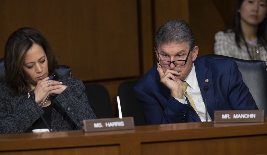 Sen. Kamala Harris, D-Calif., left, and Sen. Joe Manchin, D-W.Va., listen to Gina Haspel, President Donald Trump&#x27;s pick to lead the Central Intelligence Agency, during her confirmation hearing before the Senate Intelligence Committee, on Capitol Hill in Washington, Wednesday, May 9, 2018. Haspel, a 61-year-old career undercover spy, is a 33-year veteran at the agency in foreign and domestic assignments, and if confirmed, would be the CIA&#x27;s first female director. (AP Photo/J. Scott Applewhite)