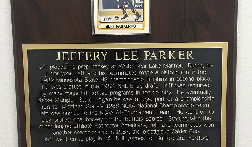 In a May 3, 2018 photo, a plaque at Chippewa Area Ice Arena in Chippewa Falls, Wis., honors former NHL player Jeff Parker, brother of Chippewa Falls High School boys hockey coach Scott Parker. Jeff was a volunteer assistant coach for the Chi-Hi team during the 1993-94 season. (Eric Lindquist/The Eau Claire Leader-Telegram via AP)