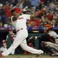 Philadelphia Phillies&#39; Maikel Franco follows through on a home run off San Francisco Giants starting pitcher Chris Stratton during the fourth inning of a baseball game Wednesday, May 9, 2018, in Philadelphia. At center is catcher Buster Posey. (AP Photo/Matt Slocum)
