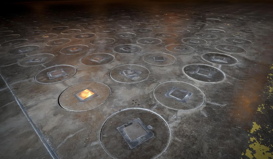 In this Nov., 20, 2013 file photo, after radioactive waste is vitrified and sealed in large stainless steel canisters they are stored under a five-feet of concrete in a glass waste storage building at the Savannah River Site near Aiken, S.C. (AP Photo/Stephen B. Morton, File)