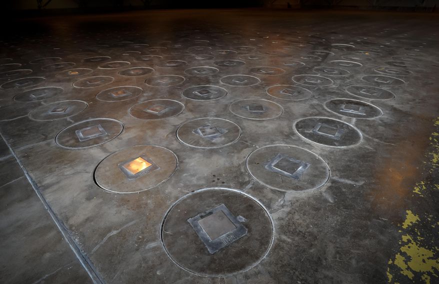 In this Nov., 20, 2013 file photo, after radioactive waste is vitrified and sealed in large stainless steel canisters they are stored under a five-feet of concrete in a glass waste storage building at the Savannah River Site near Aiken, S.C. (AP Photo/Stephen B. Morton, File)