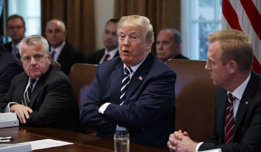 President Donald Trump speaks during a cabinet meeting at the White House, Wednesday, May 9, 2018, in Washington. From left, Deputy Secretary of State John Sullivan, Trump, and Deputy Secretary of Defense Patrick Shanahan. (AP Photo/Evan Vucci)